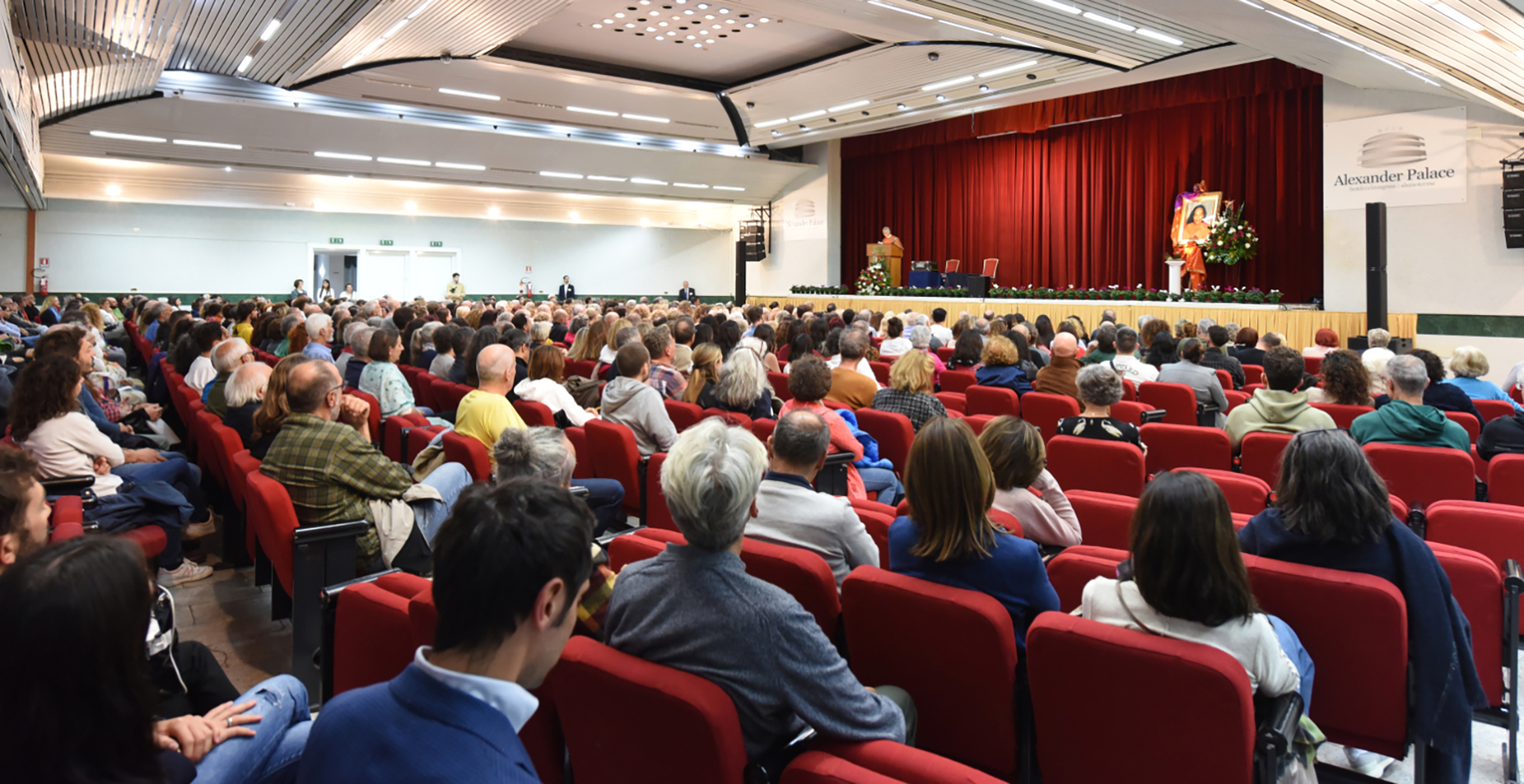 Brother Sevananda give introductory remarks at a public lecture in Abano Terme.